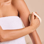 Body brush with massage nodules